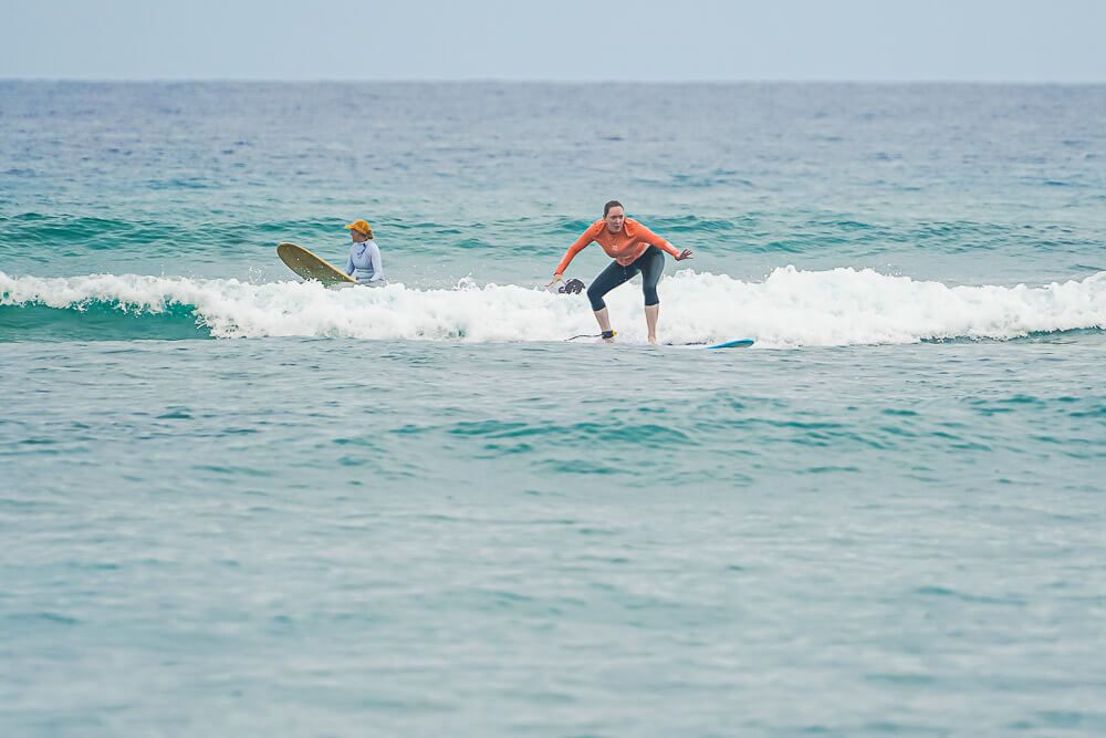 women surfing