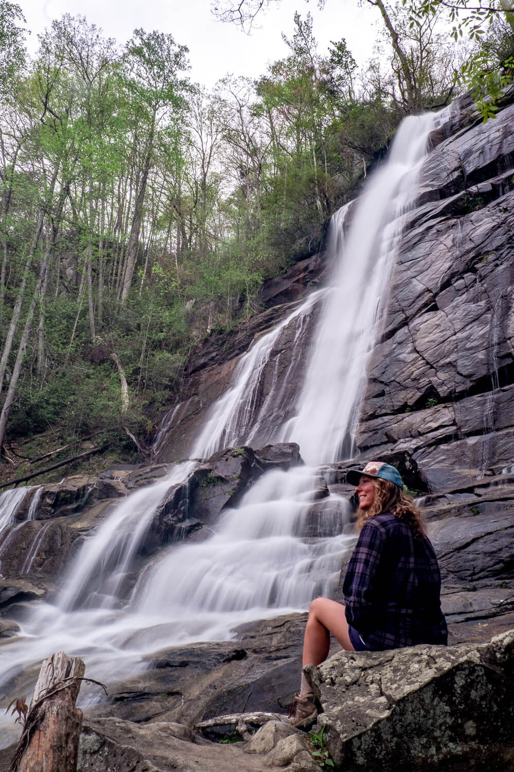 woman in front of falls creek waterfall
