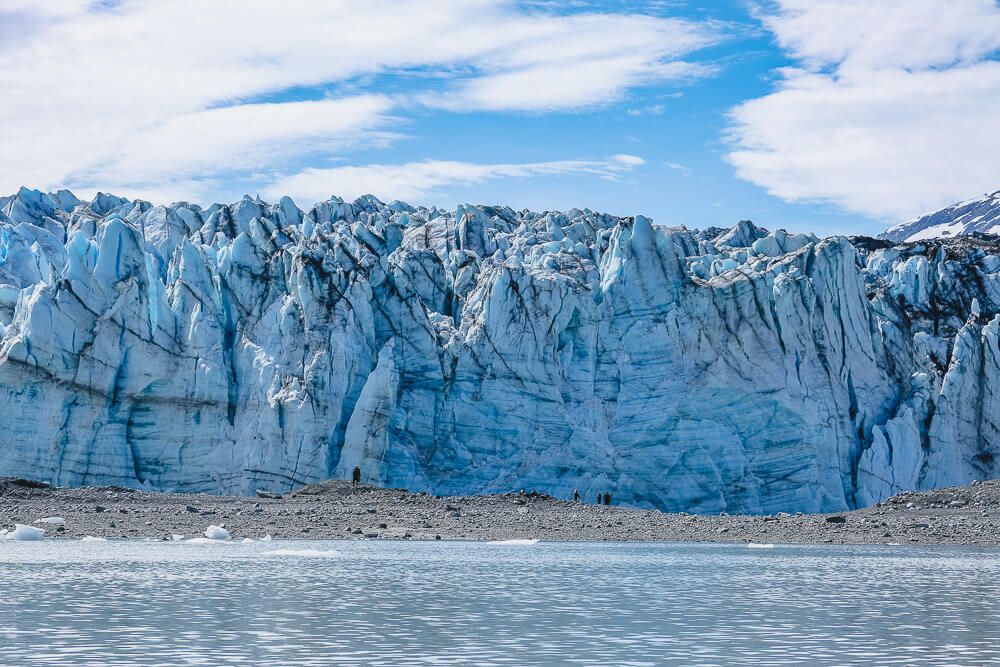 people in front of a glacier